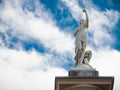 Beautiful lady statue standing alone against the cloudy blue sky at the centennial park, Sydney, Australia. Royalty Free Stock Photo