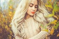 Beautiful lady surrounded autumn leaves Royalty Free Stock Photo