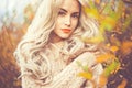 Beautiful lady surrounded autumn leaves Royalty Free Stock Photo