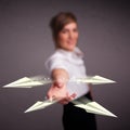 Beautiful lady throwing origami airplanes