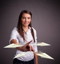 Beautiful lady throwing origami airplanes