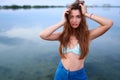 Beautiful lady on tropical island beach with flat mirror glassy water surface. Fashionable tanned woman with slim Royalty Free Stock Photo