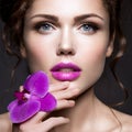 Beautiful lady with a wreath of flowers