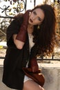 Beautiful ladylike woman with dark hair in elegant coat and leather gloves Royalty Free Stock Photo