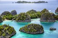 A beautiful lagoon is surrounded by limestone islands in Raja Ampat Royalty Free Stock Photo