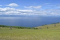 Beautiful lake Baikal from the green slope of the island.