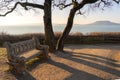 beautiful lake balaton landscape in Fonyod Hungary with decorated stone bench and the badacsony hill on the background Royalty Free Stock Photo