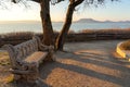 beautiful lake balaton landscape in Fonyod Hungary with decorated stone bench and the badacsony hill on the background Royalty Free Stock Photo