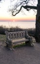 beautiful lake balaton landscape in Fonyod Hungary with decorated stone bench and the badacsony hill on the background Royalty Free Stock Photo