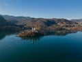 Lake Bled island with church aerial view in snowless winter with Pletna boats Royalty Free Stock Photo