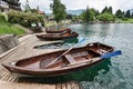 Beautiful Lake Bled in the Julian Alps and two old wooden boats. Mountains, clear aquamarine water, tourist boat, lake and