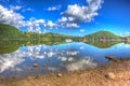 Beautiful lake with clear water and hills on a calm summer day Ullswater the Lake District England in colourful HDR Royalty Free Stock Photo