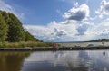 Beautiful lake coast summer landscape view. Boats parked in shore.