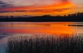 Beautiful lake with colorful sunset sky. Tranquil vibrant landscape