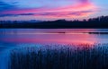 Beautiful lake with colorful sunset sky. Tranquil vibrant landscape