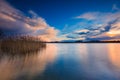 Beautiful lake with colorful sunset sky. Tranquil vibrant landscape