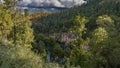 A beautiful lake in the crater of an extinct volcano is surrounded by steep rocky shores.