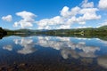 Beautiful Lake District scene Cumbria England UK Ullswater with mountains and blue sky on summer day with reflecti Royalty Free Stock Photo