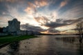 Beautiful lake in front of the old Roscommon Castle in Ireland under a cloudy sky