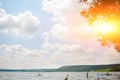 beautiful lake landscape with mountains, green forests, bright and sunny skies with clouds Royalty Free Stock Photo