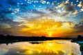 Beautiful lake landscape with vivid sunrise on the cloudy sky