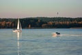 Beautiful lake landscape, yacht, balloon, birds and sunset. Blue waves, boat and horizon line on water Royalty Free Stock Photo