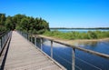 Beautiful lake in maas dunes national park, wood bridge of circular hiking trail - Reindersmeer, Netherlands