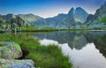 Beautiful lake with mountain reflection in Retezat, Romania Royalty Free Stock Photo