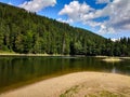 Beautiful lake in the mountains. Lake near the forest. Coniferous forest. Forest. Summer day near the lake. Royalty Free Stock Photo