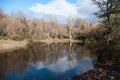 Beautiful lake scene in the forest with its reflection in the water Royalty Free Stock Photo