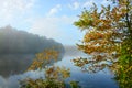 Beautiful lake scenery on the foggy autumn morning . Royalty Free Stock Photo