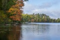 Beautiful lake and shore with trees in autumn color in northern Minnesota Royalty Free Stock Photo