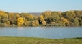 Beautiful lake Slnava in Piestany, Slovakia. Fishing place. Shining sun over the fish pond in sunny autumn day. Bright blue sky. Royalty Free Stock Photo