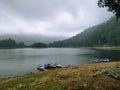beautiful lake with some boats in sarangan