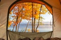 Beautiful lake view with fall leaves from a tent window