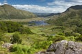 The beautiful Lakes of Killarney, nestling among the Kerry mountains on a sunny summer day. This scenic view of the valley was