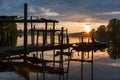 Beautiful lakeside and dock wooden boats at early morning sunrise Royalty Free Stock Photo