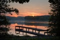 Beautiful lakeside and dock wooden boats at early morning sunrise Royalty Free Stock Photo