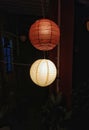 Beautiful lamp shades in the night hanging from the ceiling of the roof