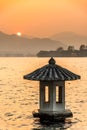 The Beautiful landsape sunset with Stone lantern at the West lake in hangzhou China Royalty Free Stock Photo