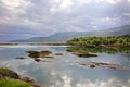 Beautiful landscape along with waters edge, with a village & church & mountains in the background, Saltstraumen, Bodo, Norway. Royalty Free Stock Photo