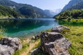 Beautiful landscape of alpine lake with crystal clear green water and mountains in background, Gosausee, Austria