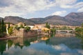 Beautiful landscape with ancient city on river bank. Bosnia and Herzegovina, view of Trebisnjica river and Old Town of Trebinje