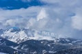 Beautiful landscape of the Arkhyz ski resort with mountains, snow, forest on sunny winter day. Caucasus Mountains, Russia Royalty Free Stock Photo