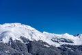 Beautiful landscape of the Arkhyz ski resort with mountains, snow, forest on sunny winter day. Caucasus Mountains, Russia Royalty Free Stock Photo