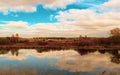 Beautiful landscape of the autumn field, the river. Storm clouds. Royalty Free Stock Photo