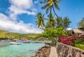 Beautiful landscape of Bequia with palm trees along the waterfront. Royalty Free Stock Photo