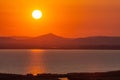 Beautiful landscape with a big setting sun over the hills, Consul Mountain