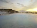 Beautiful landscape of Blue Lagoon thermal bath in Iceland with steam in a cold atmosphere in sunset with a dramatic sky