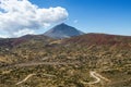 Beautiful landscape with blue sky, white clouds, mountain winding road and mount Teide. Tenerife, Canary Isla Royalty Free Stock Photo